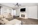 Spacious living room with a fireplace and large sectional sofa at 421 Bedford Xing, Mcdonough, GA 30253