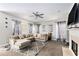 Spacious living room featuring a large sectional sofa, fireplace, and neutral color palette at 421 Bedford Xing, Mcdonough, GA 30253