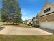 House exterior with driveway and landscaping at 156 Melrose Creek Dr, Stockbridge, GA 30281