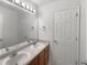 Bathroom with double vanity and updated fixtures at 156 Melrose Creek Dr, Stockbridge, GA 30281