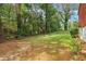 Wooded backyard with a grassy area and privacy at 8263 Chestnut Dr, Jonesboro, GA 30238