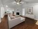 Virtually staged living room featuring fireplace and dining area at 55 Dayton Way, Covington, GA 30016