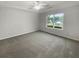 Bright bedroom with neutral carpeting and large window at 55 Dayton Way, Covington, GA 30016