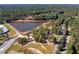 Aerial view of a lake with walking paths and a stadium at 8495 Spivey Village Way, Jonesboro, GA 30236