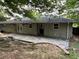 Back patio with flagstone flooring and string lights at 2334 Elmwood Se Dr, Atlanta, GA 30339