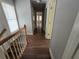 Upstairs hallway with hardwood floors and neutral walls at 3186 Dogwood Dr, Atlanta, GA 30354