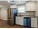 Kitchen with stainless steel appliances and granite countertops at 2911 Glenwood Se Ave, Atlanta, GA 30317