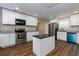 Modern kitchen with white cabinets, granite counters, and island at 2911 Glenwood Se Ave, Atlanta, GA 30317
