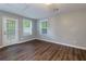 Spacious bedroom with dark wood flooring and exterior access at 2911 Glenwood Se Ave, Atlanta, GA 30317