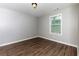 Bright bedroom featuring neutral walls and dark wood flooring at 2911 Glenwood Se Ave, Atlanta, GA 30317