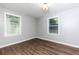Well-lit bedroom with neutral walls and wood flooring at 2911 Glenwood Se Ave, Atlanta, GA 30317