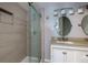 Updated bathroom with double vanity, large mirror, and walk-in shower at 2911 Glenwood Se Ave, Atlanta, GA 30317