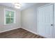 Well-lit bedroom featuring hardwood floors and a large window at 2911 Glenwood Se Ave, Atlanta, GA 30317