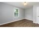 Simple bedroom with neutral walls and wood flooring at 2911 Glenwood Se Ave, Atlanta, GA 30317