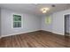 Main bedroom with hardwood floors, multiple windows, and ensuite bathroom access at 2911 Glenwood Se Ave, Atlanta, GA 30317