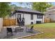 Rear view of house showing white brick exterior, deck, and firepit at 645 Cumberland Ne Rd, Atlanta, GA 30306