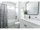 Clean bathroom with white vanity, bathtub, and modern fixtures at 90 Whitefoord Ne Ave # B, Atlanta, GA 30307