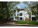 Modern white three-story home with landscaped lawn and walkway at 90 Whitefoord Ne Ave # B, Atlanta, GA 30307