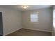 Simple bedroom with neutral walls, vinyl flooring and one window at 973 Neal Nw St, Atlanta, GA 30314