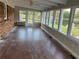 Sunroom with lake view and hardwood floors at 1078 Highway 92 S, Fayetteville, GA 30215