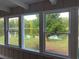 Bright sunroom with multiple windows and lake view at 1078 Highway 92 S, Fayetteville, GA 30215