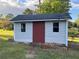 Storage shed with red door and white siding at 1078 Highway 92 S, Fayetteville, GA 30215