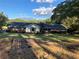Brick ranch house with a large yard and mature trees at 1078 Highway 92 S, Fayetteville, GA 30215