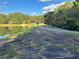 Pathway alongside a tranquil lake, offering scenic views and access to nature at 1078 Highway 92 S, Fayetteville, GA 30215