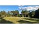 Open field with tall pines in the background at 1078 Highway 92 S, Fayetteville, GA 30215