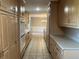 Long kitchen with ample cabinetry and tile flooring at 1078 Highway 92 S, Fayetteville, GA 30215