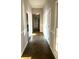 Long hallway with slate flooring and neutral walls at 1078 Highway 92 S, Fayetteville, GA 30215