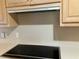 Modern glass top stove and overhead vent at 1078 Highway 92 S, Fayetteville, GA 30215