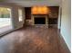 Gathering room with brick fireplace and hardwood floors at 1078 Highway 92 S, Fayetteville, GA 30215