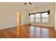 Main bedroom with hardwood floors, vaulted ceiling, and access to en suite bathroom at 1957 Brightleaf Way # 59, Marietta, GA 30060