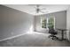 Bright bedroom with ceiling fan and carpeted floor at 311 Bradford Falls Trce, Canton, GA 30114