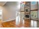 Two-story living room with hardwood floors and stone fireplace at 311 Bradford Falls Trce, Canton, GA 30114