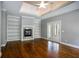 Spacious living room with hardwood floors, fireplace and built-in shelves at 311 Bradford Falls Trce, Canton, GA 30114