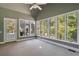 Bright sunroom with multiple windows and backyard access at 311 Bradford Falls Trce, Canton, GA 30114