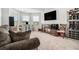 Bonus room with comfortable seating and a large TV at 2106 Cadenza Cir, Dacula, GA 30019