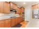 Modern kitchen with stainless steel appliances, granite countertops, and wood cabinets at 2781 Willowstone Dr, Duluth, GA 30096