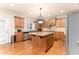 Kitchen with island, stainless steel appliances, and hardwood floors at 2781 Willowstone Dr, Duluth, GA 30096