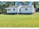 Charming white house with a large green lawn at 2408 Hillcrest Dr, East Point, GA 30344