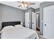 Bright bedroom featuring a king-size bed and ample closet space at 2408 Hillcrest Dr, East Point, GA 30344