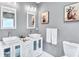 Modern bathroom with double vanity and updated fixtures at 2408 Hillcrest Dr, East Point, GA 30344