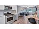 Open kitchen features stainless steel appliances and granite countertops at 2408 Hillcrest Dr, East Point, GA 30344