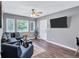 Living room features hardwood floors and a cozy seating area at 2408 Hillcrest Dr, East Point, GA 30344