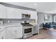 Modern kitchen with stainless steel appliances and granite countertops at 2408 Hillcrest Dr, East Point, GA 30344
