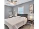 Comfortable bedroom with ceiling fan and plenty of light at 2408 Hillcrest Dr, East Point, GA 30344