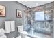 Bathroom with marble shower and glass enclosure at 2408 Hillcrest Dr, East Point, GA 30344