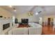 Vaulted ceiling living room with sectional sofa, fireplace, and hardwood floors at 2198 Indian Shoals Dr, Loganville, GA 30052